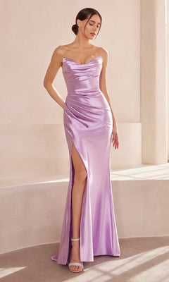 A woman stands indoors on a curved platform in the Classic Strapless Long Prom Dress: Amoris T704, a form-fitting lavender satin gown with a thigh-high slit for an elegant, formal evening look.