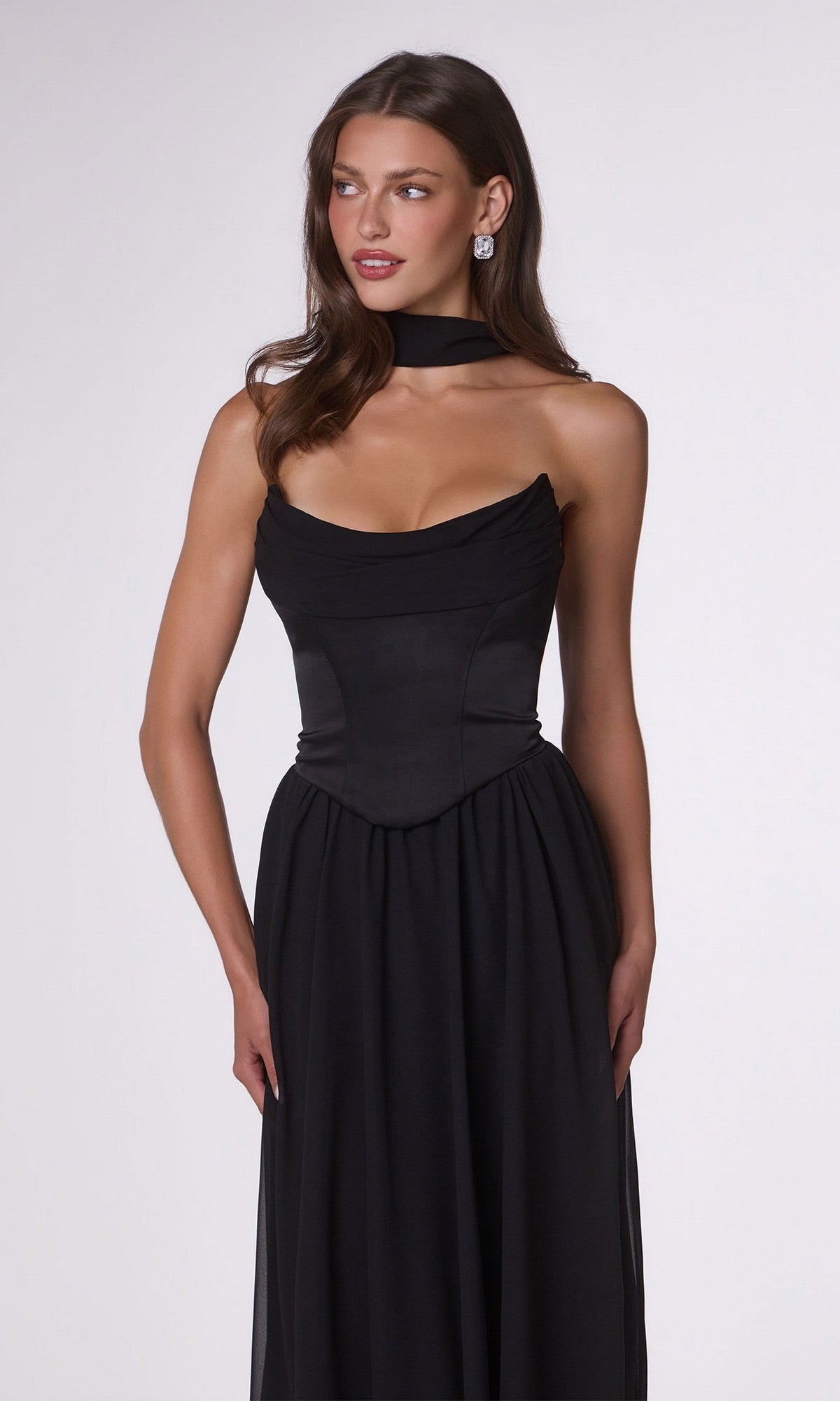 A woman models the Amoris T741 Long Prom Dress, featuring a black satin corset bodice, choker neckline, and drop shoulders, standing against a plain white background.
