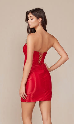 A woman stands facing away, showcasing the elegant back of the Twist-Front Strapless Short Homecoming Dress T867, a short fitted dress with a lace-up corset bodice.
