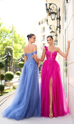 Two women stand outdoors near a building, one wearing the Long Glitter Blue Prom Dress: Tina Holly TE232, an elegant off-the-shoulder gown, and the other in a bright pink dress with a thigh-high slit.