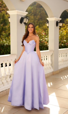 A woman in a lavender Long Formal Dress: Tina Holly TE704P stands on a tiled terrace with white columns and railings, smiling at the camera.