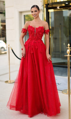 A woman in the Tina Holly TK582 long prom dress features a red corset bodice and shimmering glitter tulle—perfect for prom.