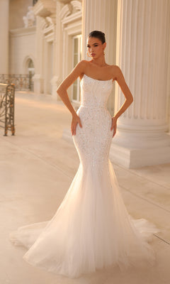 A woman in the Strapless Long Glitter Prom Gown: Tina Holly TK807 poses in an elegant hall with tall columns and soft lighting.