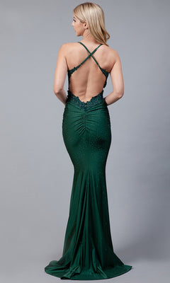 A woman models the Long Beaded Prom Dress with Lace Bodice TM1001, a fitted, floor-length emerald gown with an open back and crisscross straps, set against a plain gray background.