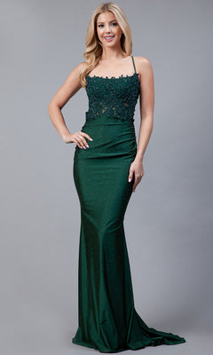 A woman wears the Long Beaded Prom Dress with Lace Bodice TM1001, a dark green, floor-length gown featuring a sheer lace bodice and fitted silhouette, standing against a plain gray background.