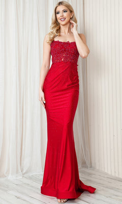 A woman stands indoors against a light curtain and wall, wearing the Long Beaded Prom Dress with Lace Bodice TM1001—a sleeveless, floor-length red gown featuring a sheer lace bodice.