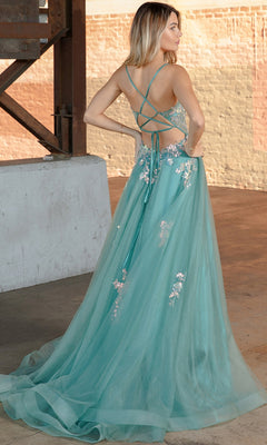 A woman in the Floral-Embellished Pastel Prom Ball Gown TM1003 poses gracefully in an industrial setting, showcasing its elegant strappy open back and delicate floral accents.