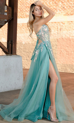 A woman poses indoors against a brick wall wearing high heels and the Floral-Embellished Pastel Prom Ball Gown TM1003, a strapless gown in teal with floral details and a high slit.