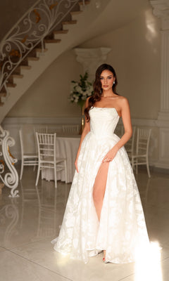 Tina Holly TW623 long wedding dress in white organza jacquard, featuring a strapless A-line silhouette with a floral pattern and a high leg slit.