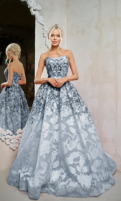 A woman in the Tina Holly TW624 long formal dress stands before a large ornate mirror, hands clasped, her reflection elegantly visible in the glass.