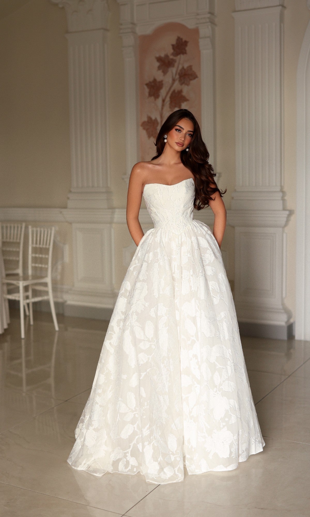 Off-white Tina Holly TW627 strapless A-line ballgown featuring a full, textured floral skirt made of organza jacquard.