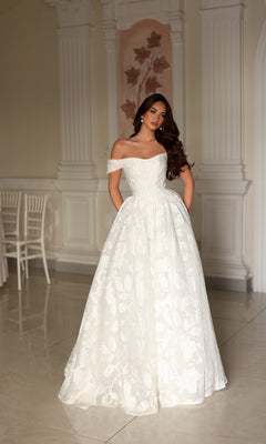 Tina Holly TW627 floor-length off-the-shoulder A-line wedding dress with a sweetheart neckline and a full organza jacquard skirt featuring a subtle floral pattern.