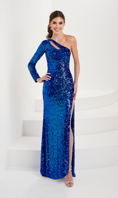 A woman smiles at the camera while wearing the Tiffany 16053 One-Sleeve Long Sequin Prom Dress with a thigh-high slit, standing on white steps.