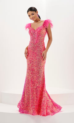 A woman stands against a white background wearing the Tiffany Fitted Sweetheart Sequin Prom Dress 16106—floor-length, pink, strapless, fitted, with sequin embellishments and feather shoulder details.