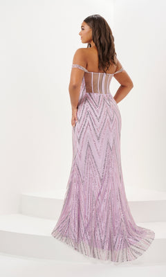 A woman stands on white steps wearing the Tiffany Long Plus-Size Sequin Prom Dress 16120, a floor-length, off-shoulder lavender gown with chevron patterns and a sheer back panel.