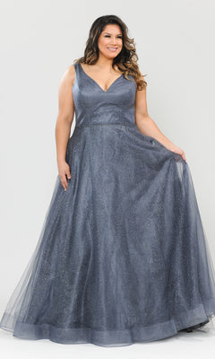 A woman models the Glitter-Tulle Plus-Size Long Prom Gown W1024, a sleeveless, floor-length dress with a V-neckline, standing against a plain light background and holding out the side of her shimmery gown.