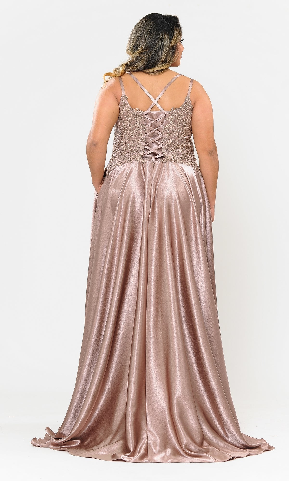 A woman wearing the Lace-Bodice Plus-Size Long A-Line Prom Dress W1094, featuring a shiny rose gold color, embroidered-lace bodice, lace-up back, and crisscross straps, stands facing away from the camera.