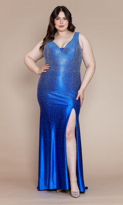 A woman wearing the Spandex Long Beaded Plus-Size Prom Dress W1130—a sleeveless, blue gown with a thigh-high slit and rhinestone embellishments—stands against a beige background.