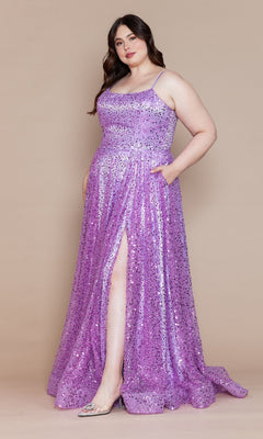 A woman in the Corset-Back Plus-Size Long Sequin Prom Dress W1142, a sparkly lavender gown with a thigh-high slit, stands against a plain beige background.
