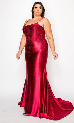 A woman wears the Plus-Size Tight Beaded Prom Dress: PolyUSA W1164, a fitted, floor-length red satin gown with thin straps and subtle beading, posing against a plain white background.