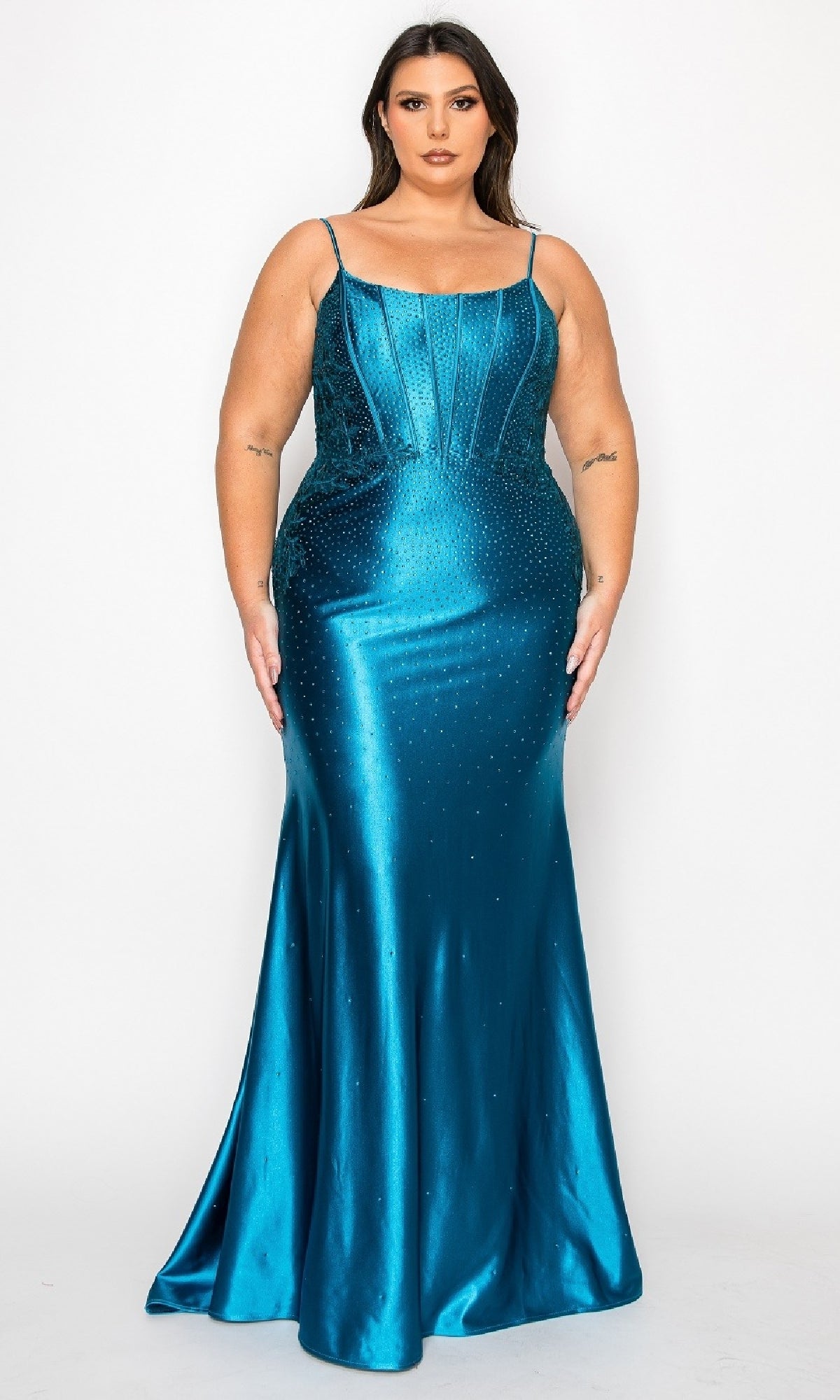 A woman models the Plus-Size Tight Beaded Prom Dress: PolyUSA W1164 in teal satin, featuring thin straps and intricate beading, standing against a plain white background.