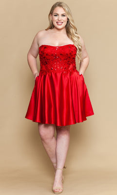 Woman wearing a red strapless dress with sequined bodice on a beige background