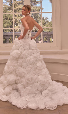 A person wearing the Strapless Ball Gown Wedding Dress: Andrea & Leo WL092, featuring a corset bodice and a skirt covered in layered fabric rosettes.