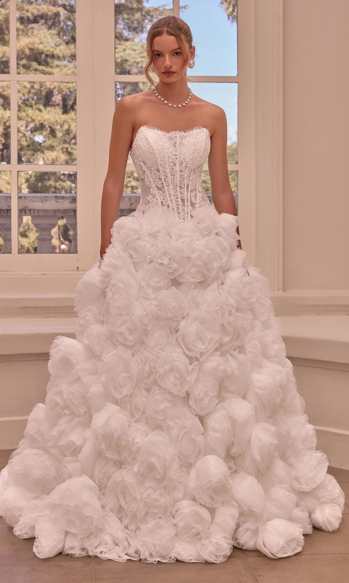 Off-white strapless Strapless Ball Gown Wedding Dress: Andrea & Leo WL092 featuring a corset bodice and a skirt covered in large, layered 3D rosette fabric.