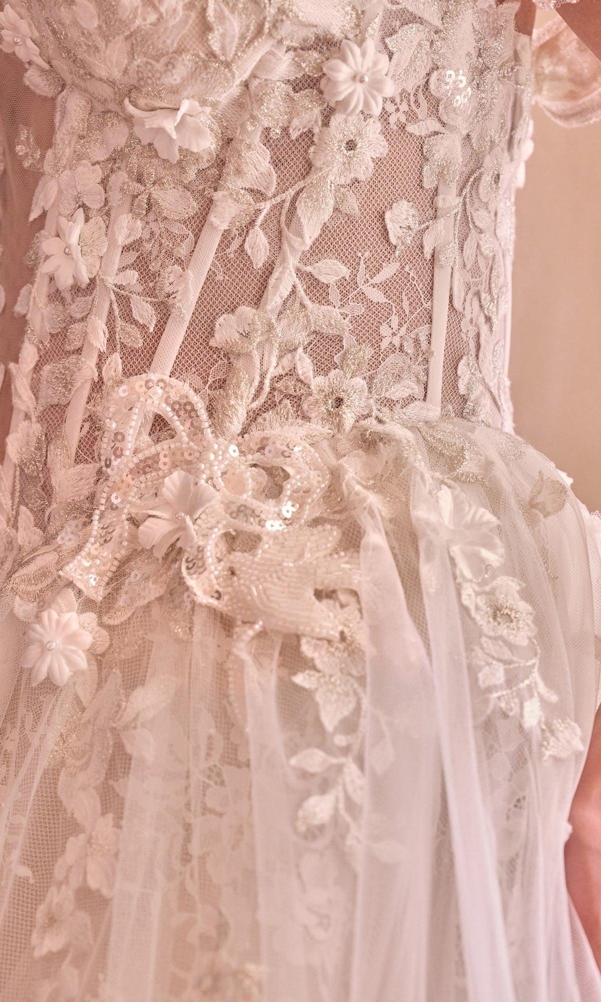 Close-up of the Long French White Wedding Dress: Andrea & Leo WL093, featuring floral lace, intricate sequin embroidery, and tulle overlays.