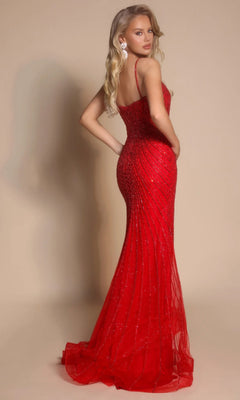 A woman poses with one hand on her hip in the Long Formal Dress: Portia and Scarlett XO019, a fitted, floor-length red gown with thin straps and elegant beadwork, set against a plain background.