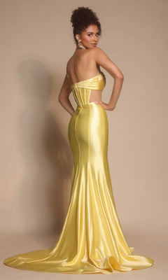 A woman faces backward, looking over her shoulder in the Portia and Scarlett XO066 long formal dress featuring a strapless satin design with a pleated crossover bodice and a flowing train.