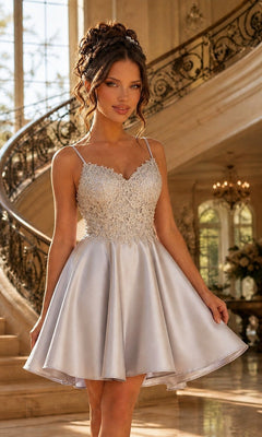 A woman in a silver Beaded-Bodice Short A-Line Homecoming Dress XR6008 stands on an elegant grand staircase.
