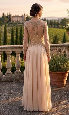 Wearing the Chicas XR6014 long prom dress, a woman stands on a stone terrace at sunset, the elegant gown featuring long sleeves, lace detailing, and an embellished bodice as she gazes over a lush scenic landscape.