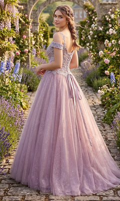A young woman in the Chicas YG5012 Long Formal Dress, a lavender off-the-shoulder gown, stands on a stone path in a flower garden, looking over her shoulder.