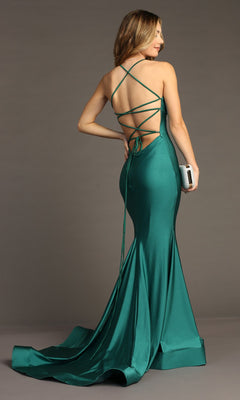 A woman wearing the Strappy Open-Back Long Prom Dress Chicas YG5024 in teal green satin stands with a silver clutch, her lace-up open back to the camera.