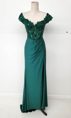 The Sequin-Bodice Long Prom Dress (Chicas YG5027) features an emerald green off-the-shoulder lace bodice, sequin corset details, floral appliqué, and a draped floor-length skirt, displayed on a dress form.