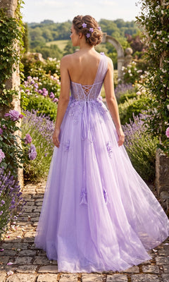 A woman stands on a stone path in a garden, surrounded by purple flowers and greenery, wearing the Long Prom Dress: Chicas YG5028—a lavender, one-shoulder gown featuring an a-line glitter tulle skirt—facing away from the camera.