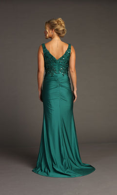 A woman stands facing away in the Sequin-Bodice Long Prom Dress: Chicas YG5032—an emerald green gown with a fitted, beaded bodice and a V-shaped back, perfect for any formal occasion.