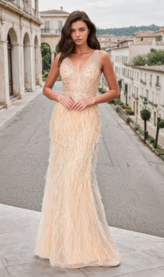 A woman stands on a cobblestone street wearing the Long Champagne Feather Prom Dress: Chicas YG5036, a floor-length, sleeveless gown featuring feather details and sequin embellishments.