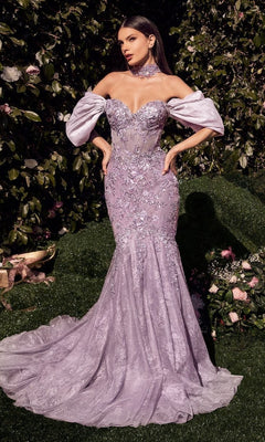 A woman stands outdoors in the Andrea & Leo A1354 Long Mermaid Prom Dress, a strapless, form-fitting lavender gown with beaded floral embroidery, lace details, matching off-the-shoulder sleeves, and a choker.