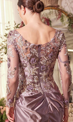 A woman with her hair in a bun wears the Andrea and Leo A1403 long formal dress, featuring lavender sheer embroidered sleeves and back, plus a delicate floral lace bodice, as she stands indoors facing away from the camera.