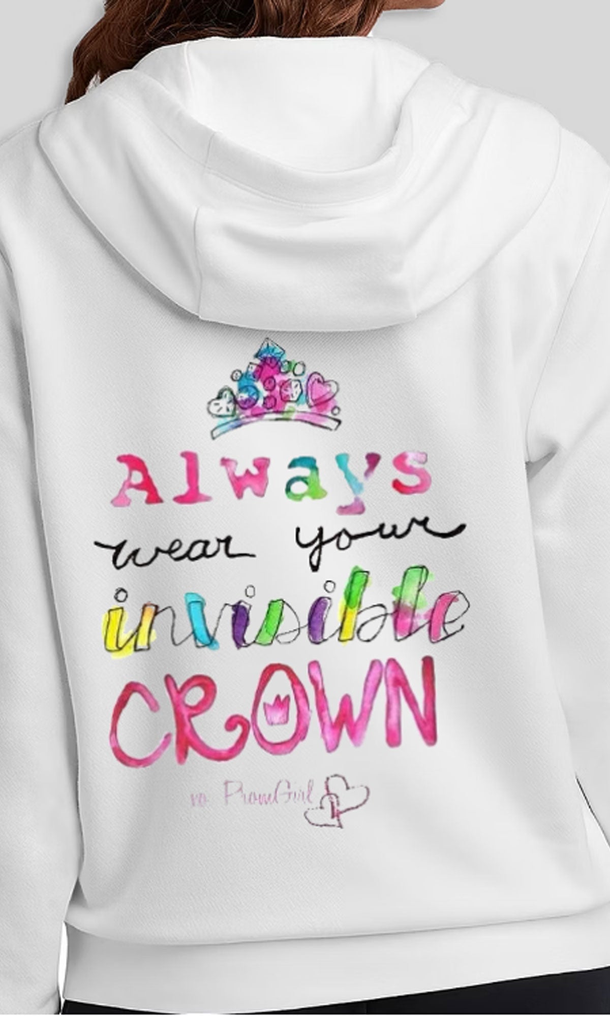 A person wears the Always Wear Your Invisible Crown Hoodie—a white hoodie with colorful 