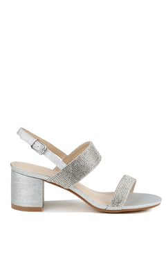 Step out in style with the Ares Silver Glitter Prom Dress Shoes: Touch Ups 4653, featuring a silver, low-block heel, ankle strap with buckle closure, and two glittery straps—perfect for a sparkling night out.