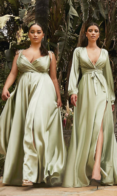 Two women wearing sage green dresses by Ladivine walk outdoors surrounded by greenery.