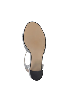 The image displays the sole of the Cam Silver Shimmer Prom Dress Shoe (Touch Ups 4638), featuring a beige bottom and black textured block heel tip, shown from the bottom with an open-toe silver design.