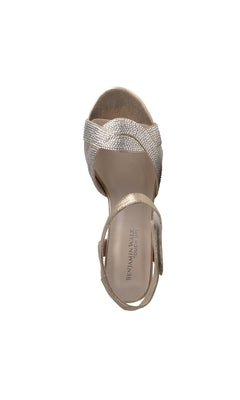 The Cam Champagne Prom Shoes: Touch Ups 4639 is a gold open-toe high-heeled sandal featuring a textured crisscross strap and a Velcro ankle strap, shown from an overhead view.
