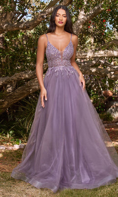 A woman stands outdoors in the Sheer-Corset Long Prom Ball Gown CD0154, a sleeveless, floor-length lavender dress with a beaded fitted bodice and flowing tulle skirt. Trees and greenery are visible in the background.