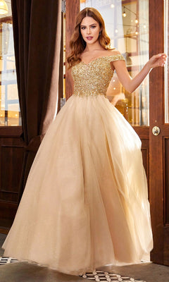A woman in the Ladivine CD0177 Beaded-Bodice Long Prom Dress with a glittery fitted bodice and full tulle skirt stands indoors by wooden doors and brown curtains.