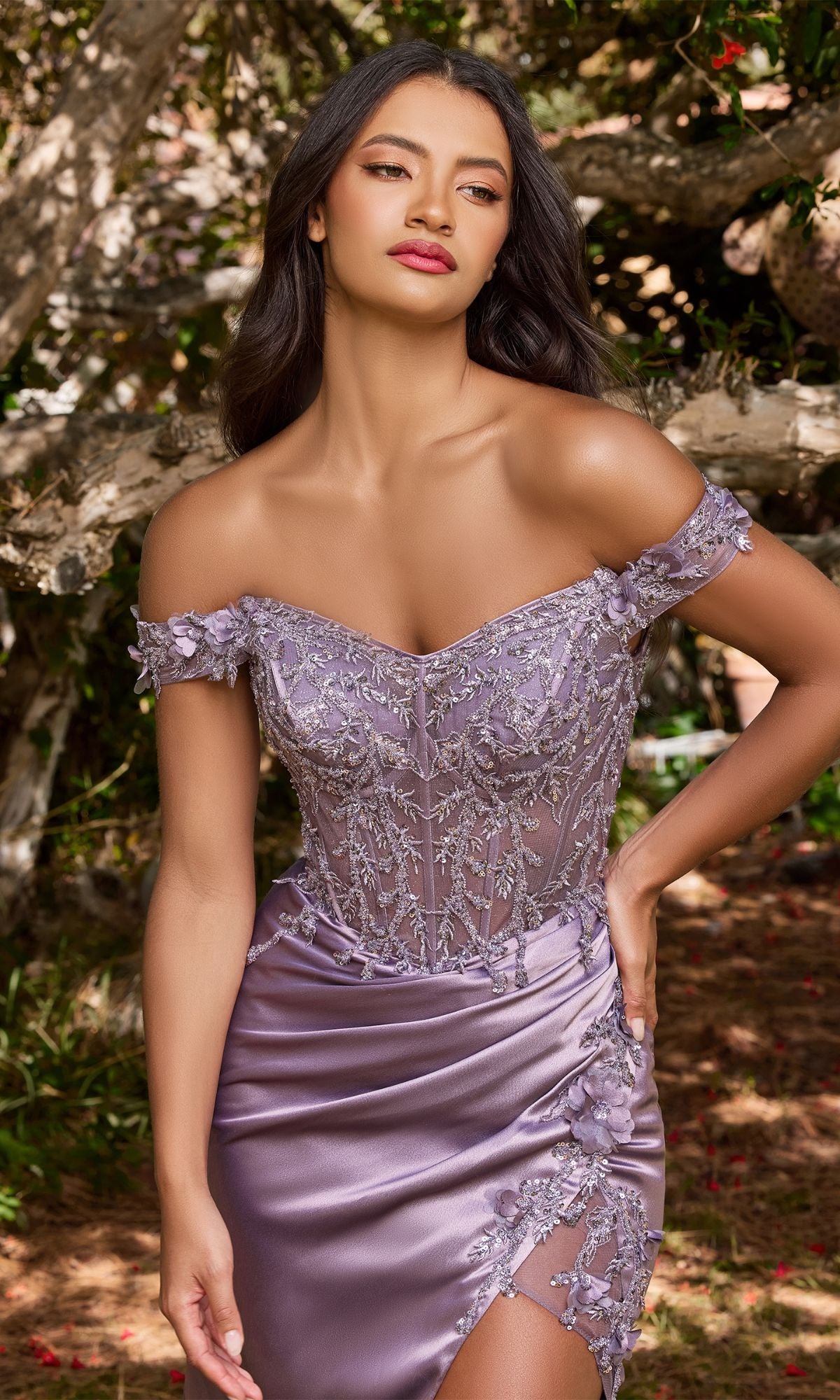 A woman stands outdoors in front of trees, wearing the Off-the-Shoulder Long Sweetheart Prom Dress CD0186 in lilac with glittery embroidery and floral details.