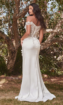 A woman wearing the Off-Shoulder Long White Corset Prom Dress CD0186W stands outdoors, facing away, with trees and grass surrounding her.